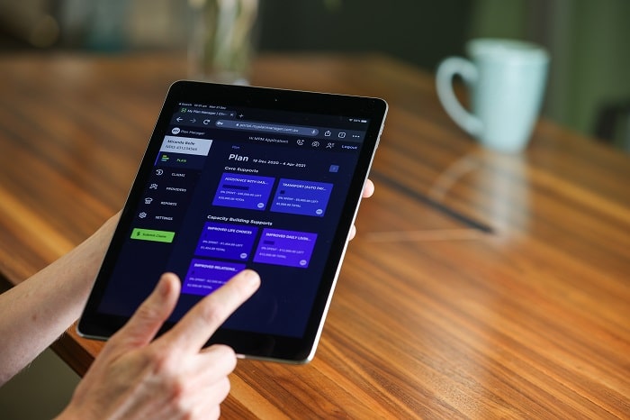 Close up of the MPM Client portal displayed on a tablet