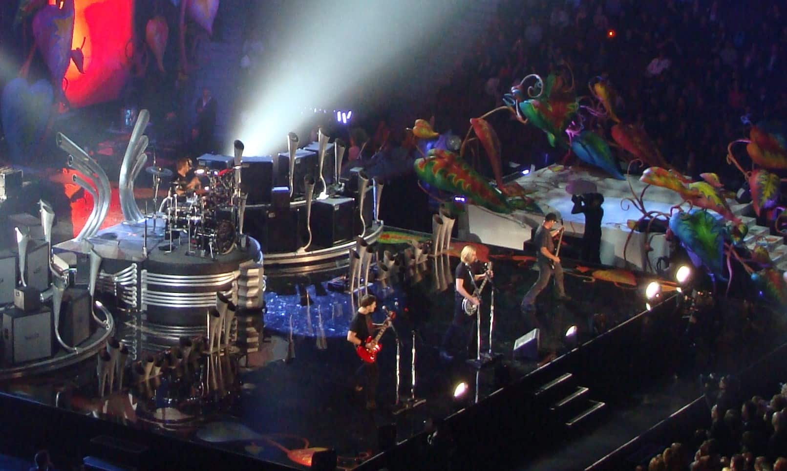 The band Nickelback playing at a concert.