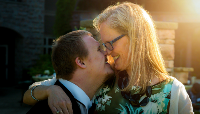 A mother and son rub noses.