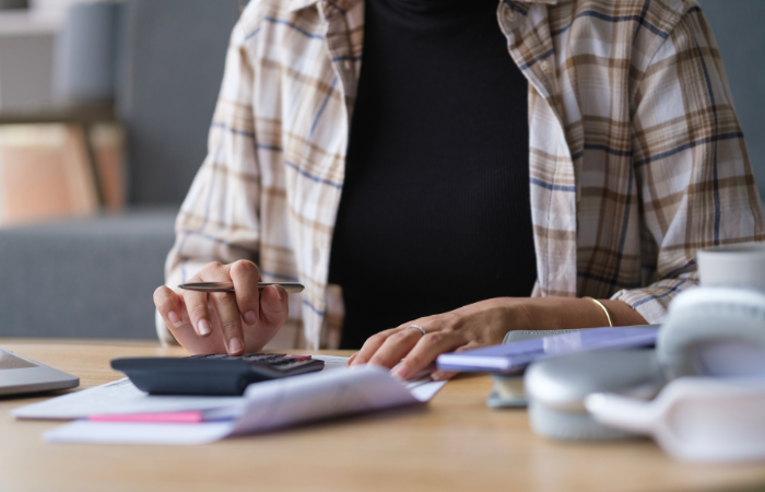 A person using a calculator.
