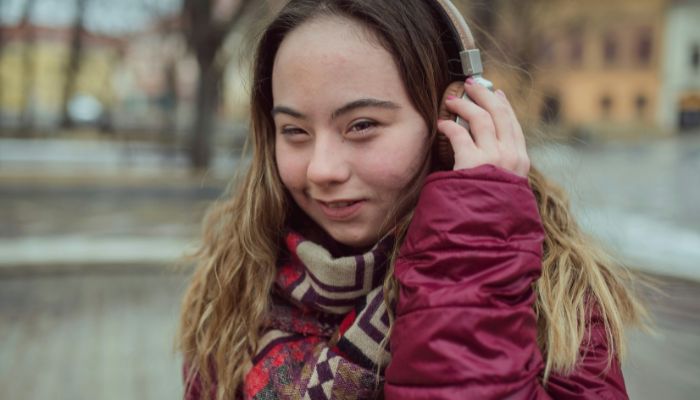 A close-up of a person in a scarf and a jacket.